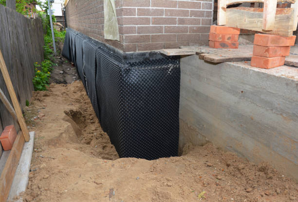 Happy homeowners after waterproofing job in Saint Paul